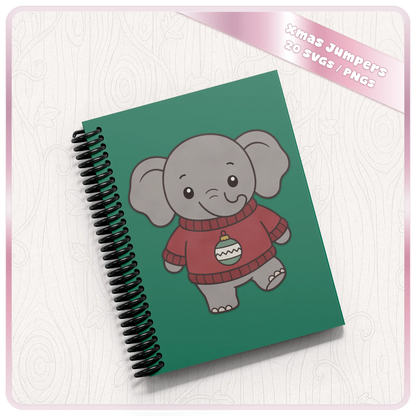 Christmas elephant SVG design displayed on a green spiral notebook mockup, featuring a cute kawaii elephant wearing a red Christmas jumper with festive bauble.