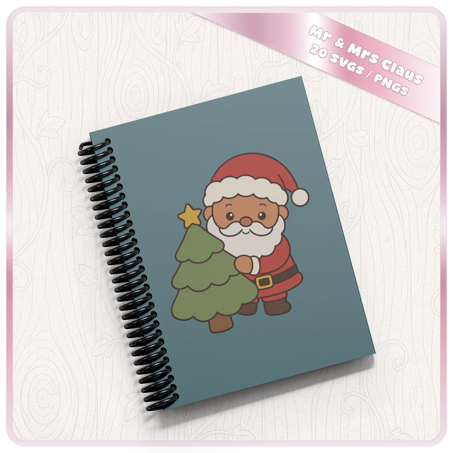 Cute Santa Claus Christmas tree SVG design displayed on a blue spiral notebook mockup from the 20 design Santa and Mrs Claus Christmas bundle.