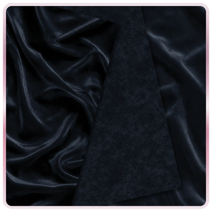Seamless black velvet fabric texture with rich deep tones and soft light reflections, elegant dark background pattern