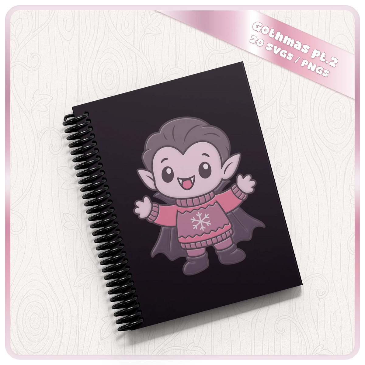 Cute gothic Christmas vampire wearing a festive jumper on a black spiral notebook, showcasing a Gothmas SVG and PNG design for personalised gifts.