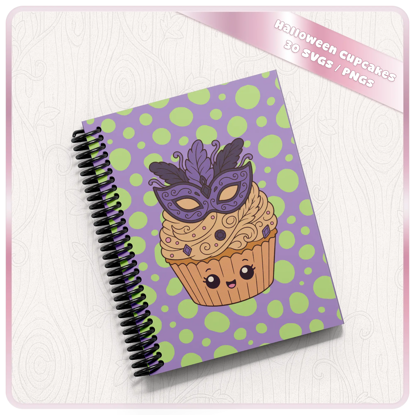 Halloween cupcake SVG and PNG mockup showing cute masquerade mask cupcake artwork on a spiral notebook with purple and green polka dot background.