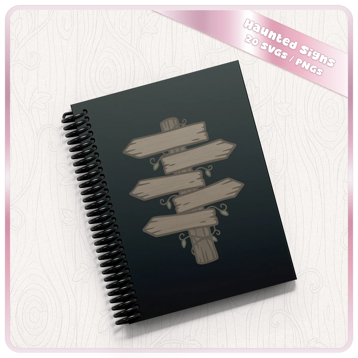 Rustic haunted forest wooden arrow sign clipart displayed on a dark spiral notebook, showcasing a woodland SVG design for journals and personalised gifts.
