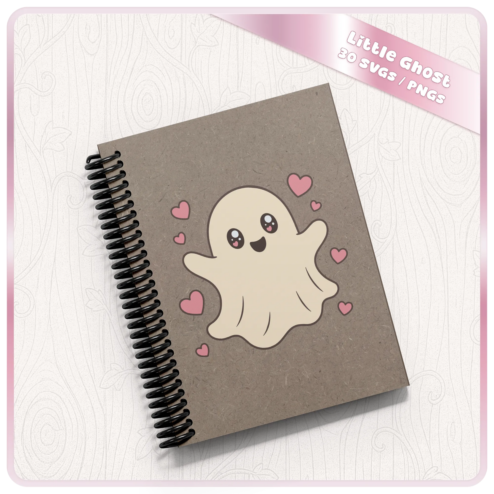 Cute ghost with hearts PNG and SVG design displayed on a grey spiral notebook mockup for Halloween stationery, stickers, and printable craft ideas.