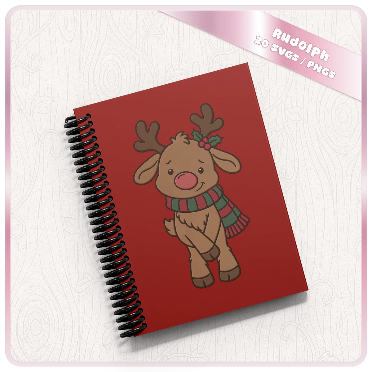 Red spiral notebook featuring a cute Rudolph reindeer Christmas illustration with a striped scarf and holly, made using festive SVG and PNG clipart.