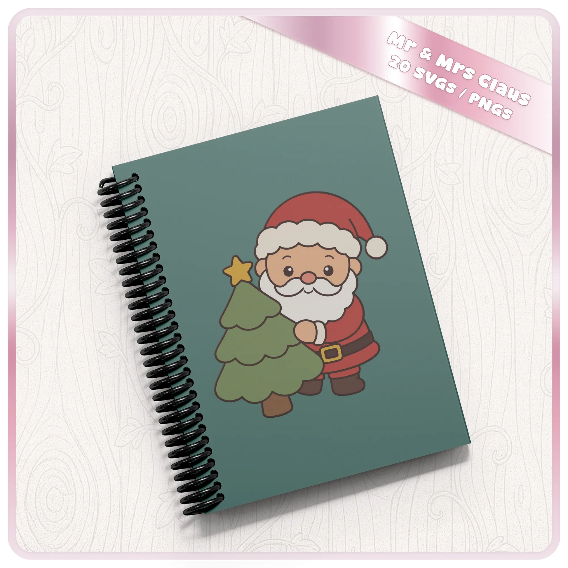 Cute Santa Claus with Christmas tree SVG and PNG design displayed on a teal spiral notebook mockup from the 20 design Christmas clipart bundle.