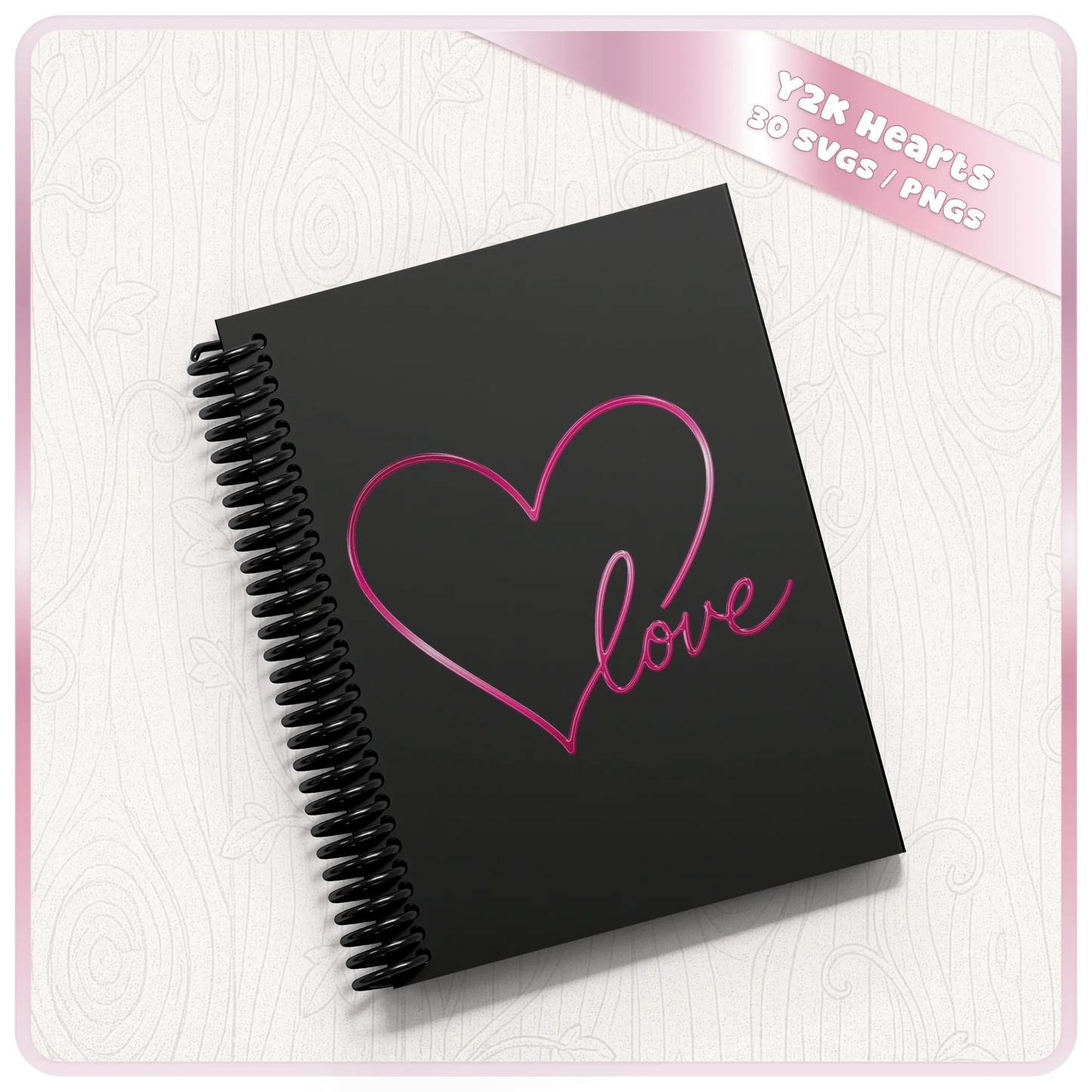 Y2K heart and love SVG displayed on a black spiral notebook featuring a glossy pink hand drawn heart and script love design.